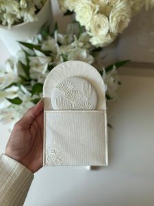 Embroidered mirrors inside an embroidered envelope off-white color. with off-white embroidery