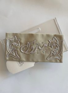 Beige fabric envelope with hand-embroidered sarma (silver embroidery)
