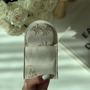 Embroidered mirror inside an embroidered envelope